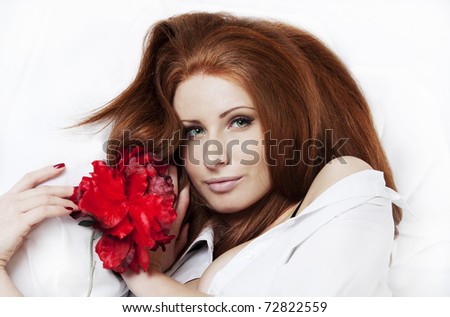 Closeup of young beautiful woman with gorgeous ginger hair