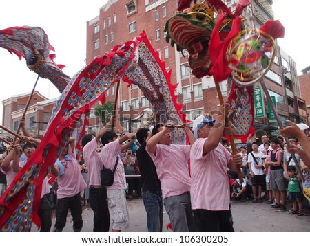 TAIPEI,TAIWAN- JUNE 24:The dragon dance in  Culture and Art Festival of Tamsui Shing Shuei Yan on June 24,2012 in Taipei,Taiwan. The fair held annually for honor of the Ching-Shui Master.