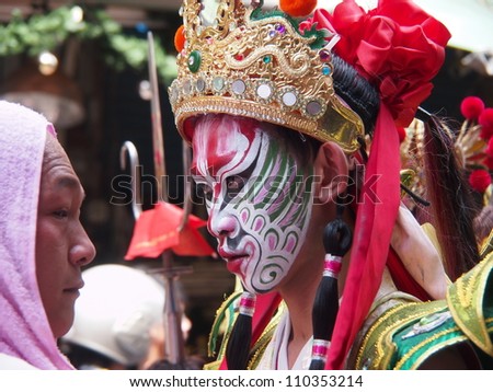 TAIPEI,TAIWAN- JUNE 24: People dressed up as statues of holy general in the Culture Festival of Tamsui on June 24, 2012 in Taipei,Taiwan. The is fair held annually for honor of the Ching-Shui Master.
