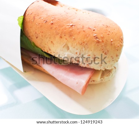 baguette sandwich with lettuce, tomato, smoked ham and cheese