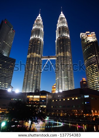 KUALA LUMPUR - APRIL 15: Petronas Twin Towers on April 15, 2013 in Kuala Lumpur. Petronas Twin Towers were the tallest buildings in the world from 1998 to 2004, but remain the tallest twin buildings