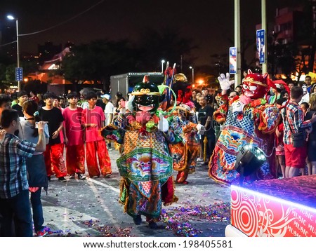 TAMSUI,TAIWAN - June 3 : The folk-custom acrobatics in the temple fair of township in night on June 3,2014 in Tamsui,Taipei,Taiwan. The fair held  annually on chinese lunar date of sixth in May.