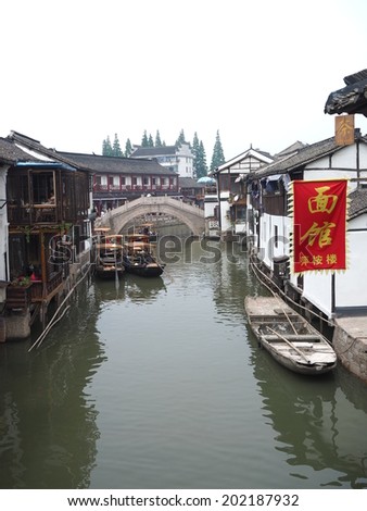 SHANGHAI, CHINA - MAY 21: Tourist visits Zhujiajiao on May 21, 2014 in Shanghai. Zhujiajiao is a well-known ancient water village  as Shanghai\'s version of Venice.