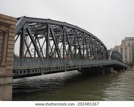 SHANGHAI, CHINA - MAY 19 : Tourists at Waibaidu Bridge on May 19, 2014 in Shanghai, China. The Waibaidu Bridge was constructed in 1907 and was the first steel truss bridge to be built in China.