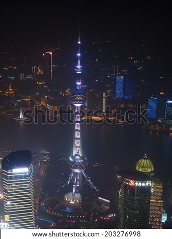 SHANGHAI,CHINA - MAY 21: Above the city skyline, the Shanghai World Financial Center or SWFC on May 21, 2014 in Shanghai, China. It offers the world\'s highest observation deck, 474m above ground level
