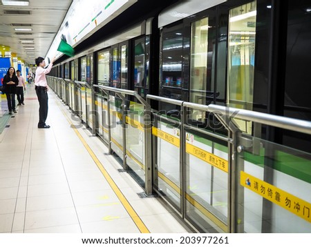 SHANGHAI, CHINA - MAY 17: Shanghai subway station interior on May 17, 2014 in Shanghai, China. The Shanghai Metro system has 12 lines, 287 stations and is the longest and 3th busiest in the world.