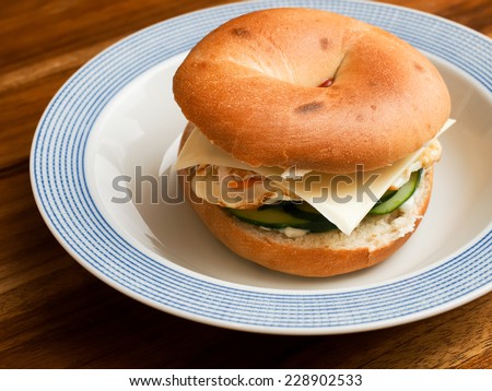 Isolated Bagel Omelet and bacon sandwich top view