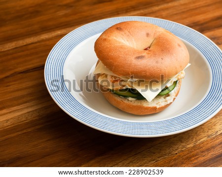 Isolated Bagel Omelet and bacon sandwich top view