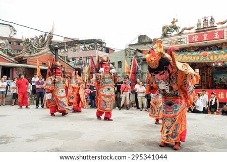 TAMSUI,TAIWAN- June 21:People dressed up statues of holy general on June 21,2015 in Tamsui,Taipei,Taiwan. The fair held annually for honor of the Ching-Shui Master.