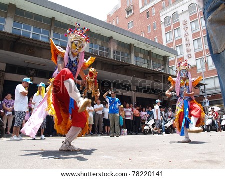 TAMSUI,TAIWAN- JUNE 20: Folk-custom acrobatics are performed during the CingShuai temple fair on June 20, 2007 in Tamsui, Taipei, Taiwan. The fair is held annually in honor of the Ching-Shui Master.