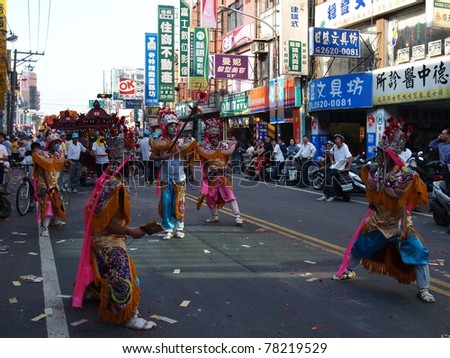 TAMSUI, TAIWAN - JUNE 20: The folk-custom of acrobatics are performed during the CingShuai temple fair on June 20, 2007 in Tamsui, Taipei, Taiwan. The fair is held annually for honor of the Ching-Shui Master .