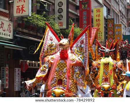 TAMSUI, TAIWAN - JUNE 20: The parade formation in the CingShuai temple fair on June 20, 2007 in Tamsui, Taipei, Taiwan. The fair held annually for honor of the Ching-Shui Master.