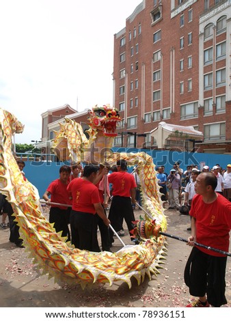 DANSHUI,TAIWAN- JUNE 7:The dragon dance in Culture and Art Festival of Danshui Shing Shuei Yan  on June 7,2011 in Danshui,Taipei,Taiwan. The fair held annually for honor of the Ching-Shui Master.