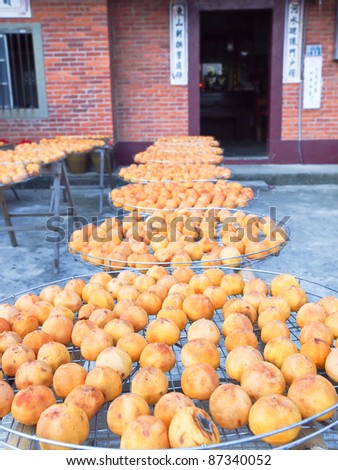 Dry persimmons under the sun. Traditional Taiwan persimmon snack and food.