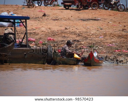 SIEM REAP, CAMBODIA-Mar 20: Cambodian people live  on Tonle Sap Lake in Siem Reap, Cambodia on March 20, 2012. Tonle Sap is the largest freshwater lake in SE Asia peaking at 16k km2