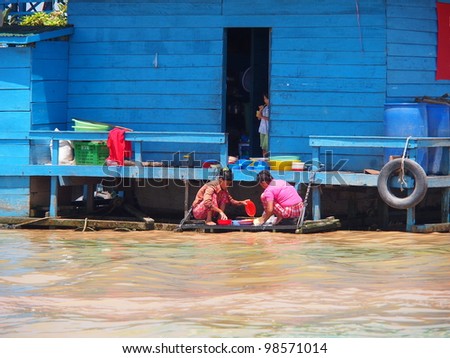 SIEM REAP, CAMBODIA - Mar 20: Cambodian people live beside Tonle Sap Lake in Siem Reap, Cambodia on March 20, 2012. Tonle Sap is the largest freshwater lake in SE Asia peaking