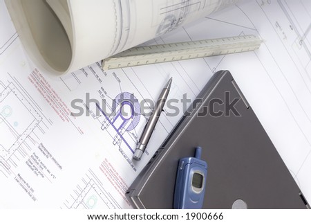 An Engineer\'s tools of the trade lay on a desk