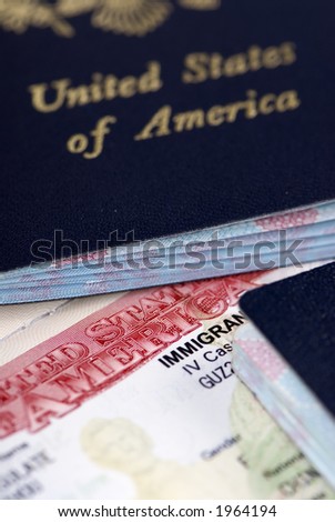 A close up of an Immigrant Visa and US passport