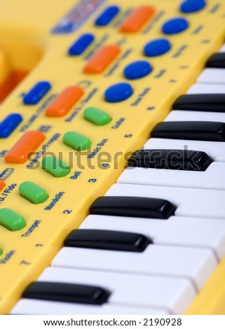 A child's electric piano with colorful keys and buttons