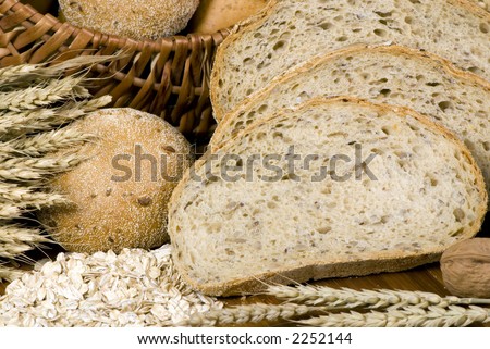 An assortment of whole grain wheat breads on a table.