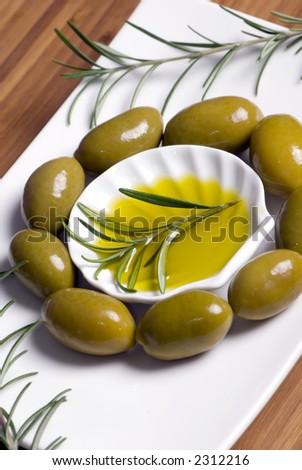 A decorative tray of olives brighten up the dinner table