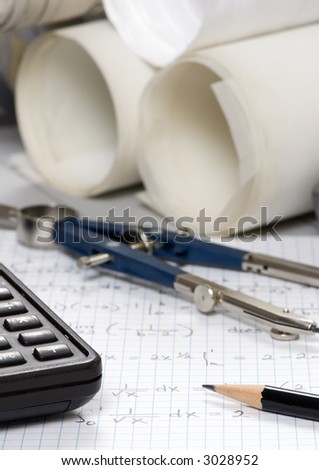 An Engineer calculates the final figures for a design