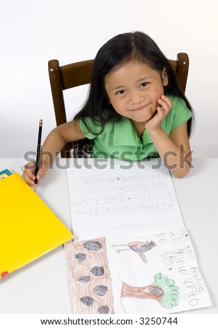 A young girl learning to read and write.