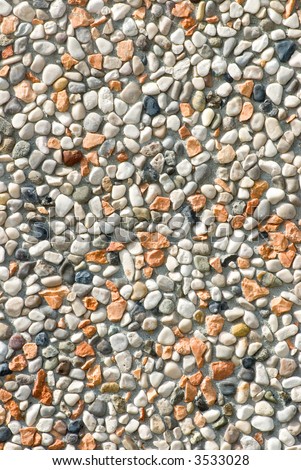 A pebble rock background of various types of rocks