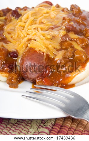 An inviting but unhealthy chili cheese dog.