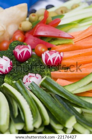 A tray of fresh cut vegetables ready to be served.