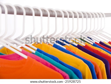 A lot of bright colored Tee Shirts hanging