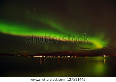 Amazing northern lights (Aurora borealis) on the Reykjavik coast, Iceland