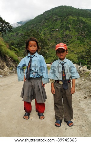DARJEELING, INDIA - OCTOBER 27: Small unidentified children go home from school in Darjeeling, India on October 27, 2010. Education has been made free for children for 6 to 14 years of age in India.
