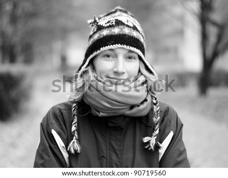 Portrait of Young smiling woman in winter, Black and white tone