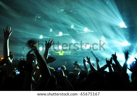 stock photo A dj performing at a disco rave