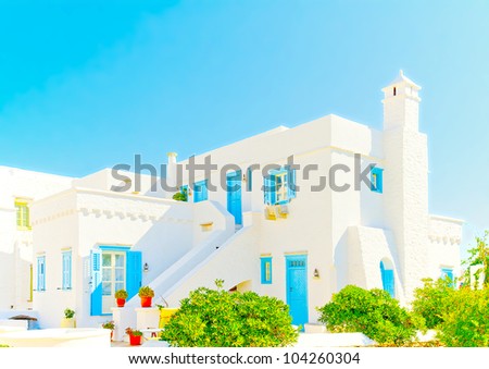 ?eautiful complex of traditional old houses with blue colored doors and  windows in Chora the capital of Amorgos island in Greece