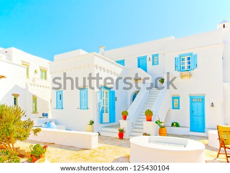 Beautiful complex of traditional old houses with blue colored doors and  windows in Chora the capital of Amorgos island in Greece
