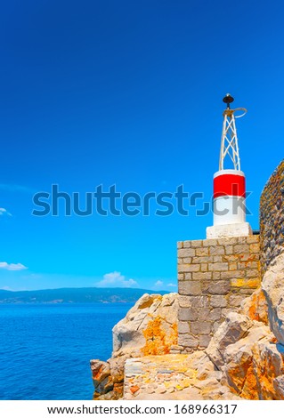 The red port light of the main harbor of Hydra island in Greece