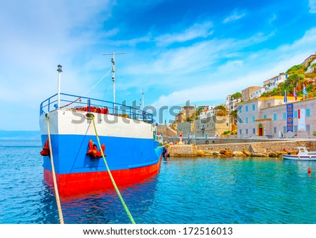 water tanker docked in the main port of Hydra island in Greece