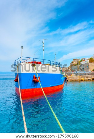 water tanker docked in the main port of Hydra island in Greece