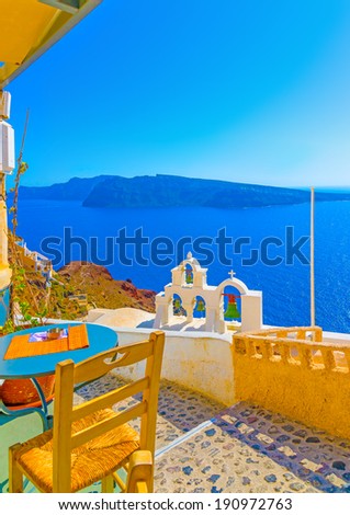 Amazing view to the sea including a multi Belltower from an old traditional church in Oia the most beautiful village of Santorini island in Greece