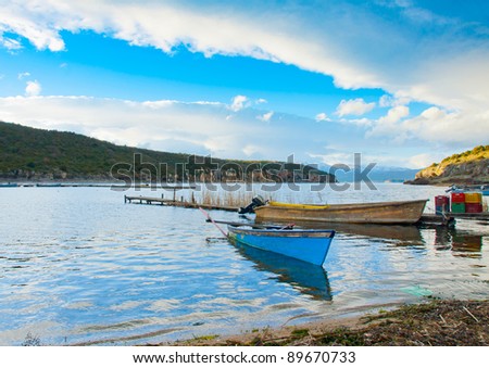 Traditional old wooden fishing boats in the lake Prespa near Psarades village in northern Greece