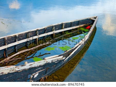 Destroyed old wooden fishing boat in the lake Prespa near Psarades village in northern Greece