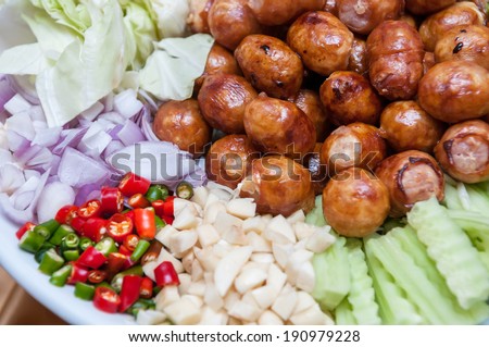 Thai Sausage Style, Sausage Northeastern Style served in a dish with side dishes (Sai Krawk E-san)