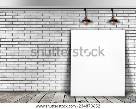 Poster standing in White Brick wall with Ceiling lamp