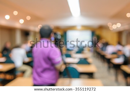 abstract blurred image of cameraman video camera recording in conference meeting