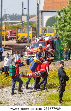 NINE, PORTUGAL - APRIL 12, 2014: Emergency workers at a scene of a train accident simulation in Nine train station