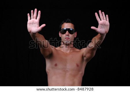 Please! stop! Young shirtless man holding his hands out saying \'stop\'