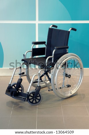 wheel chair over green background