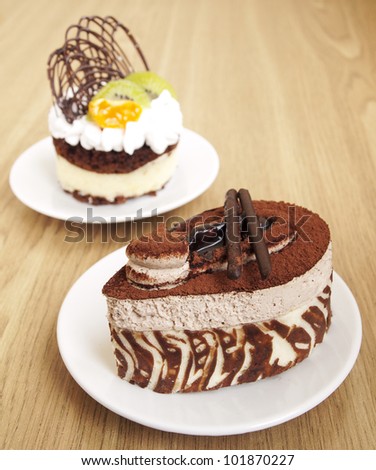 Chocolate Cake and cake with fruits on the table